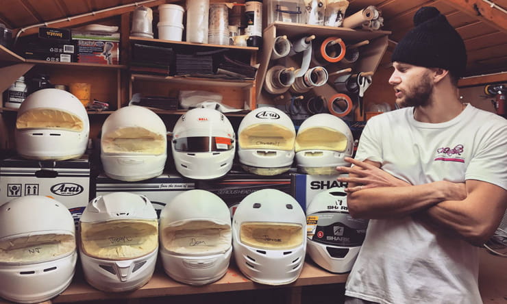 DrKolor stands next to some unpainted helmets